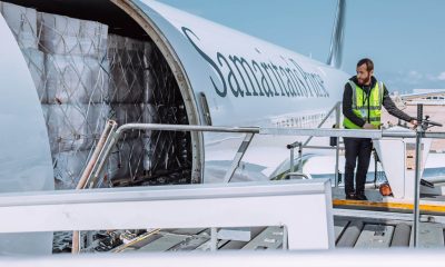 Side door of Samaritan's Purse 767 aircraft open as someone begins to offload supplies