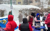 Food distribution outside tent in Kyiv
