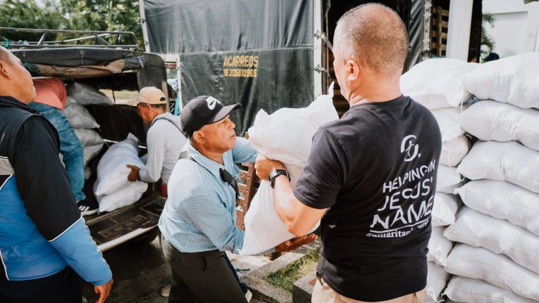Dozens of local pastors loaded Samaritan's Purse food bundles onto vehicles to distribute to their own hurting communities deeper within the flooded region.