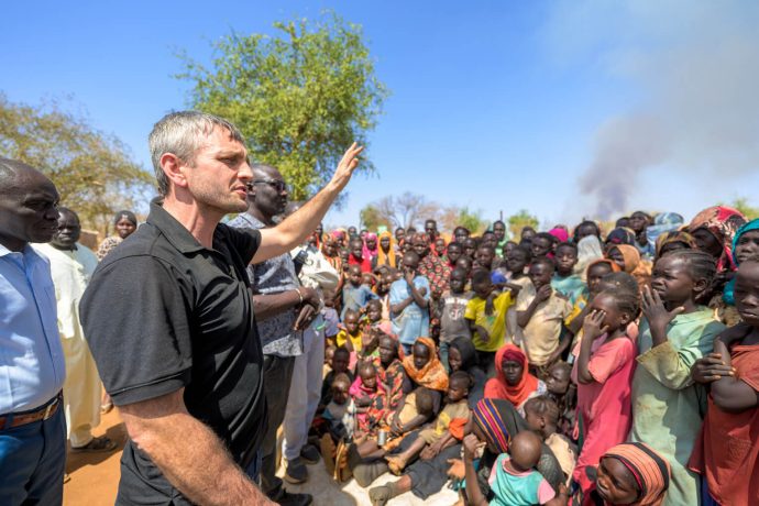 In a recent visit to southern Sudan, Philips shares the Gospel to hundreds of displaced people at a camp where we distribute food and provide basic medical services. Several people raise their hands to accept Jesus Christ as Lord and Savior. 