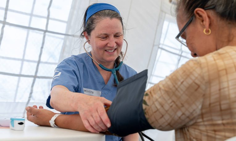 Medical teams with Samaritan's Purse assist a patient in the Mariana Islands near Saipan as we begin to care for residents at out outpatient and mobile clinics.