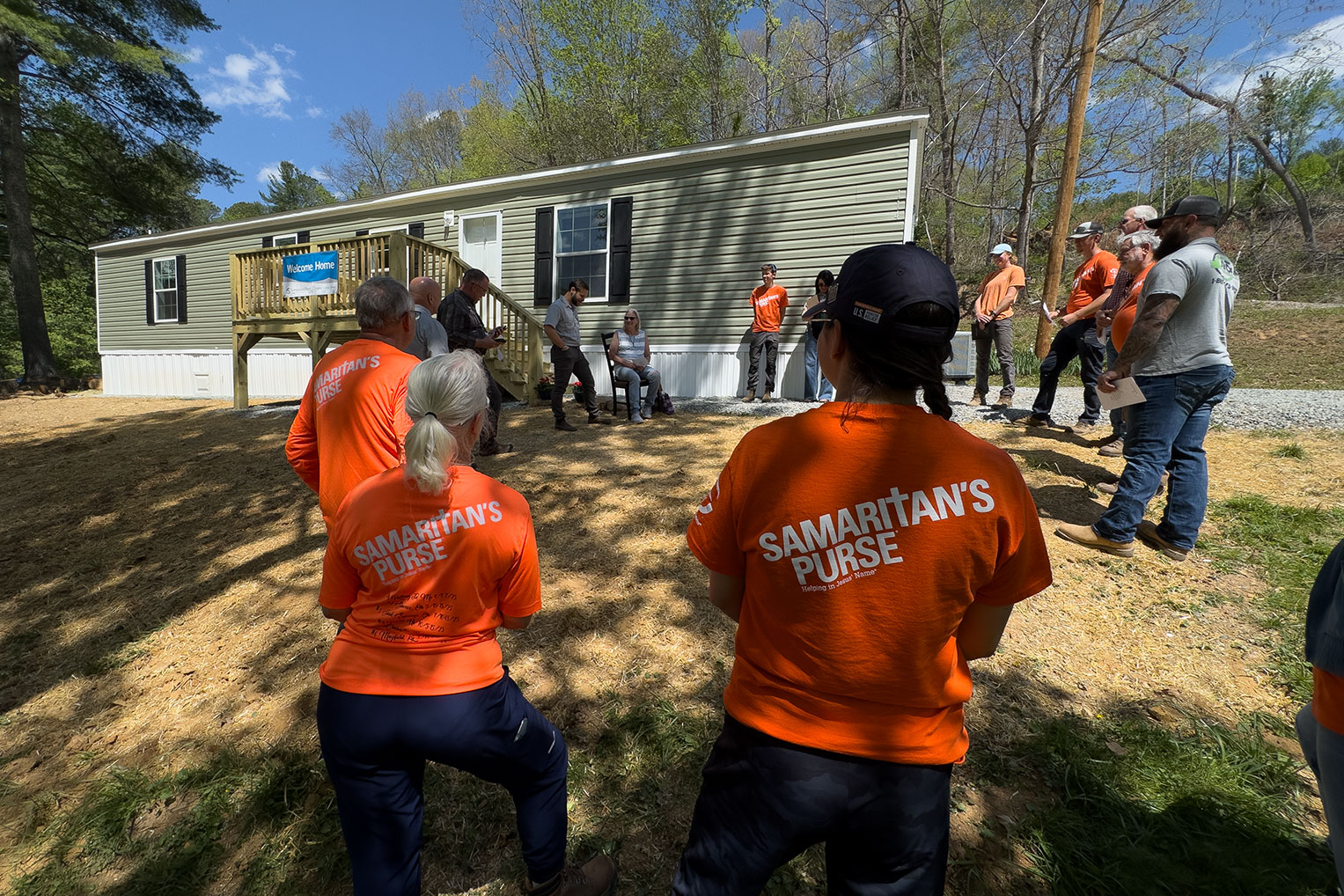 Staff and volunteers joined Andrea in celebrating and dedicating her new home.