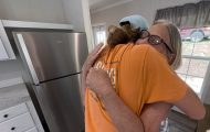 Andrea Green embraces a Samaritan's Purse rebuild team member as she celebrates her new home.