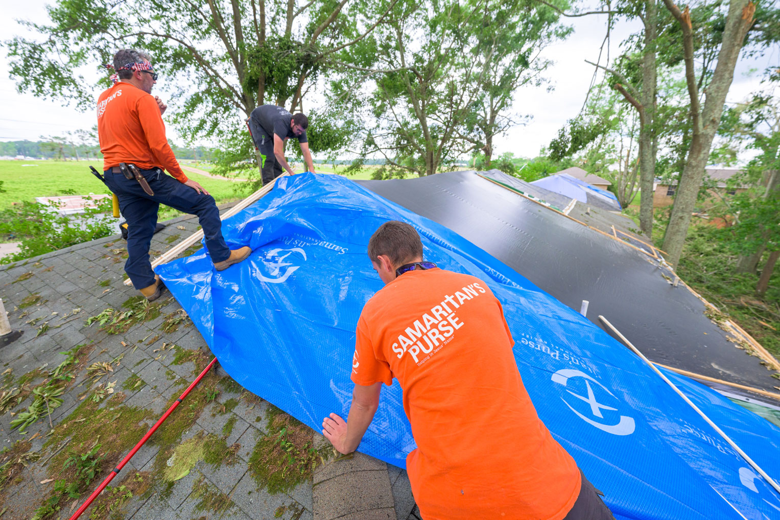 Landry Touchstone's roof was damaged by direct hit from a fallen tree. Our volunteers patched the hole to avoid further damage and make her home habitable until repairs can be done.