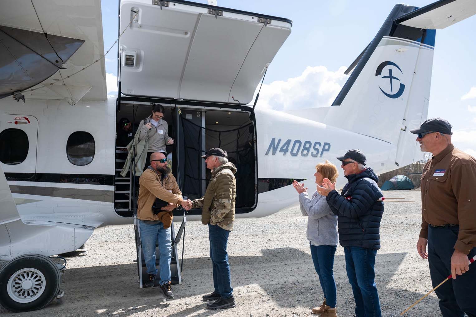 2650US-A1-319 Samaritan's Purse President Franklin Graham met the couples as they disembarked from our aircraft.