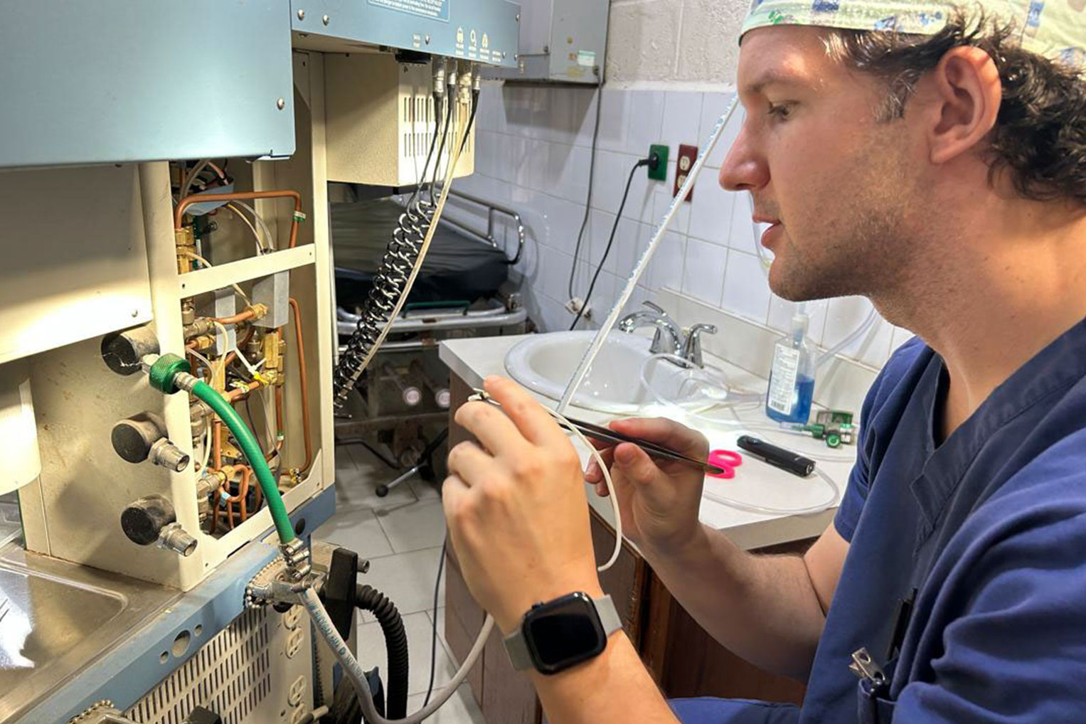 Dr. Buchanan is also skilled at repairing machines in places where medical technologists aren't available.