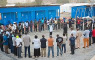 Staff gather to pray at the Bunia treatment center on Thursday, June 11.