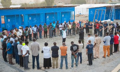 Staff gather to pray at the Bunia treatment center on Thursday, June 11.