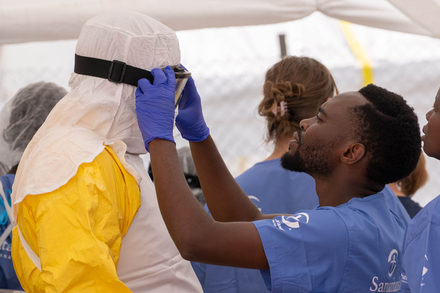 The donning and doffing of Personal Protective Equipment is an exact protocol for medical personnel treating patients in our Ebola Treatment Centers.
