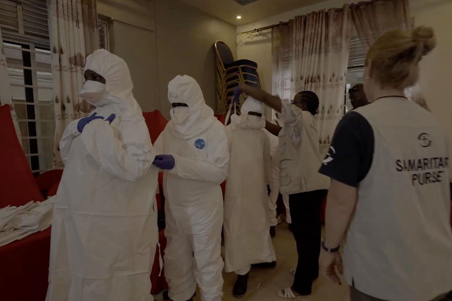 Local medical staff learn proper donning and doffing procedures during PPE training conducted by Samaritan's Purse.