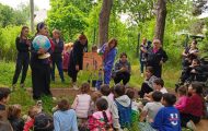 A globe peaks children's interest at an Operation Christmas Child outreach event outside Tbilisi, Georgia