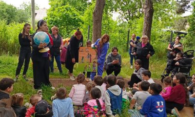 A globe peaks children's interest at an Operation Christmas Child outreach event outside Tbilisi, Georgia