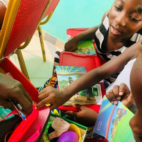 Children in Gabon explore what's inside each other's shoebox gifts