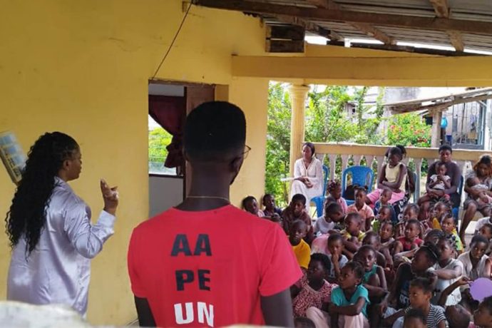 children listen attentively at an Operation Christmas Child outreach event