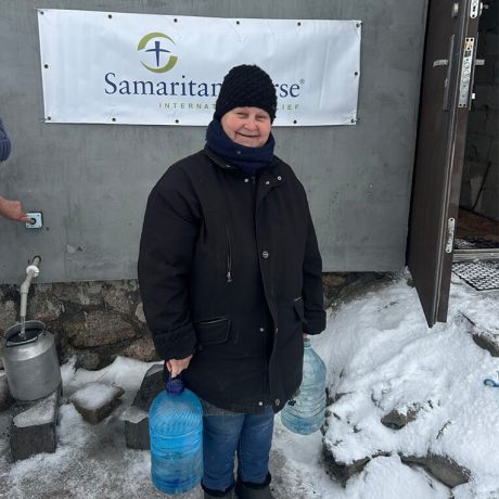 Kateryna holding water bottles