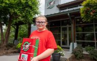 Abigail Porter holds a shoebox she packed in front of the Operation Christmas Child offices in Boone, North Carolina