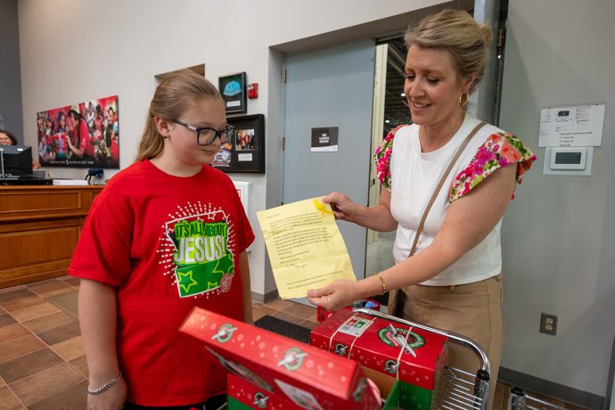 A Samaritan's Purse staff member displays a letter Abigail included in one of her shoebox gifts.