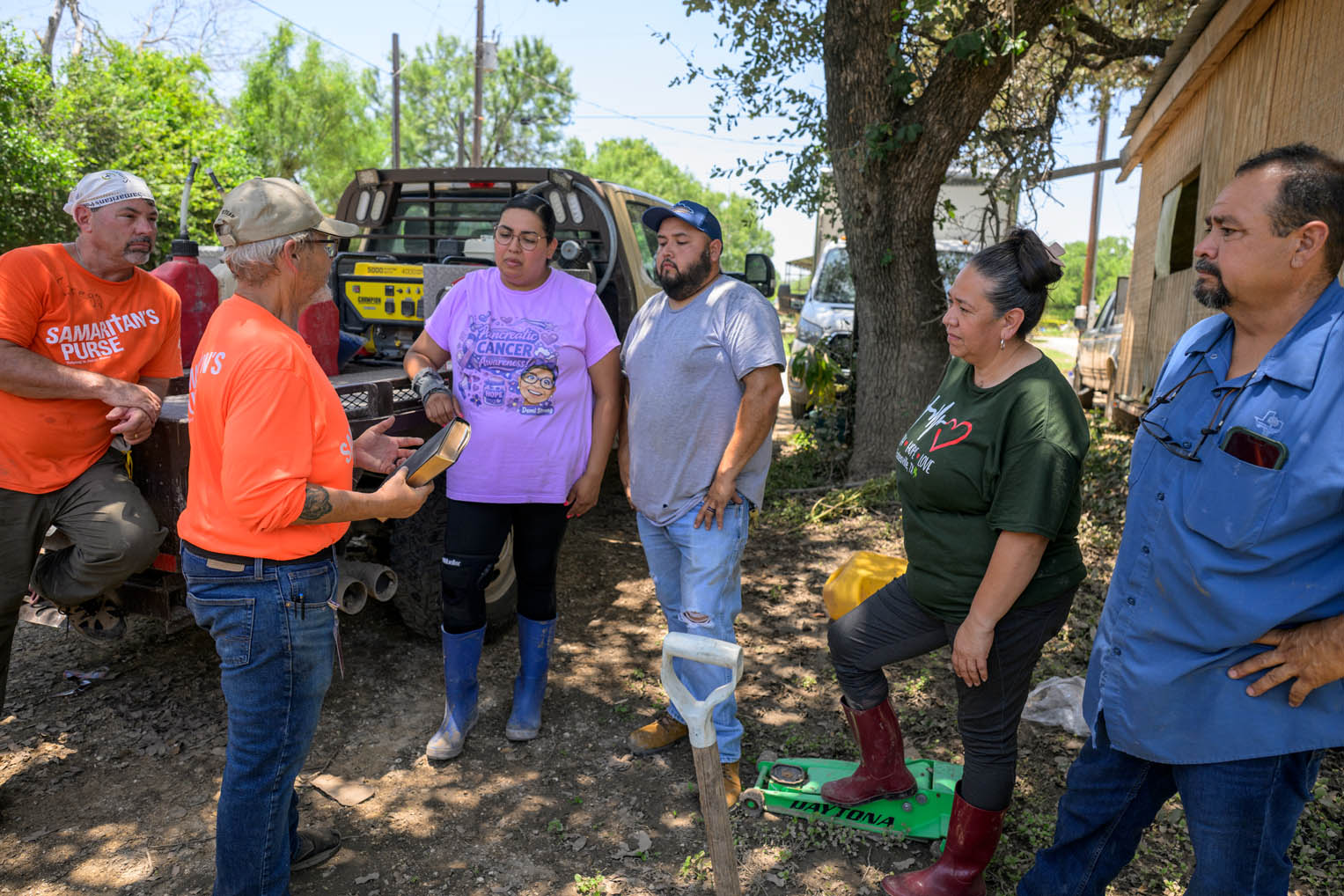 Volunteers encouraged the family from God's Word and presented them with a special Billy Graham Training Center Bible signed by the team at the completion of their work.