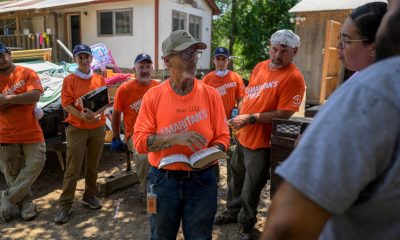 A volunteer team encourages Joseph and Jacqueline Ayala after working at their Batesville, Texas, property where the Guadalupe River flood many homes in the southwest part of the Lone Star state.