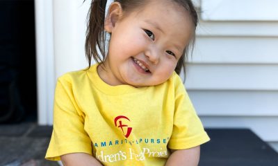 Mongolian girl smiles while turning her head to one side