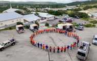 Volunteers and chaplains circle up to pray before serving homeowners in our 2025 flood response to Kerr County, Texas