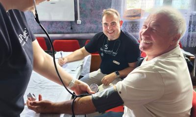 Mobile Medical Unit staff take the blood pressure of Mykhailo