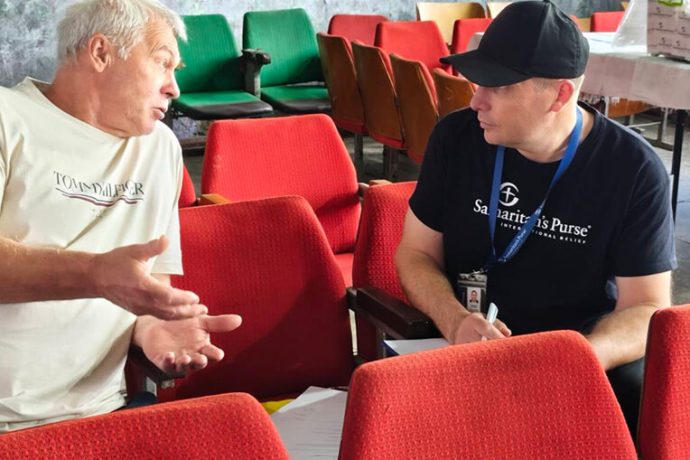 Mykhailo talks with a staff member of Samaritan's Purse Mobile Medical Unit