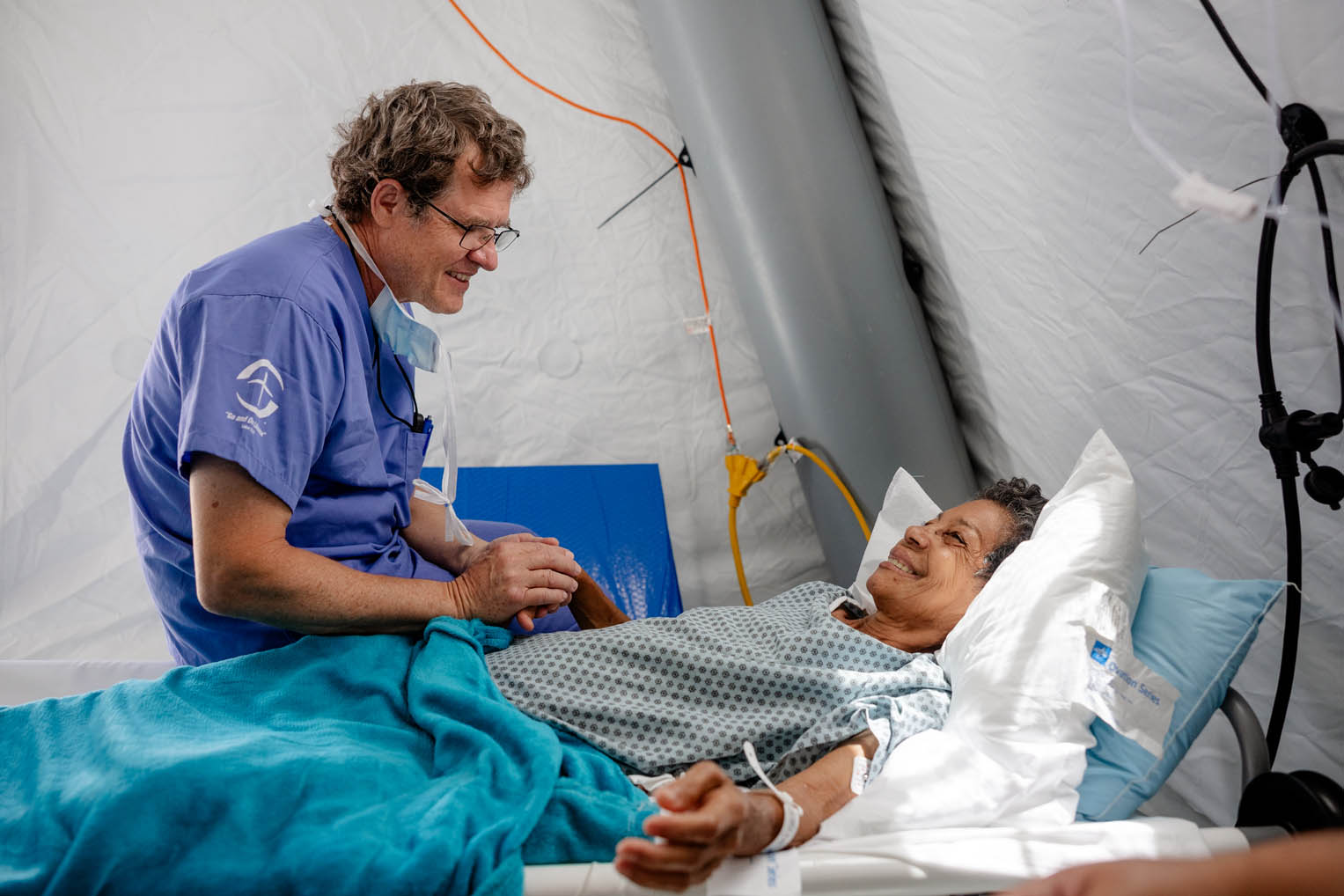 Dr. Cooper meets with a surgical patient at our field hospital where our team has completed more than 200 surgical procedures since the June 24 earthquake that destroyed large portions of La Guaira.
