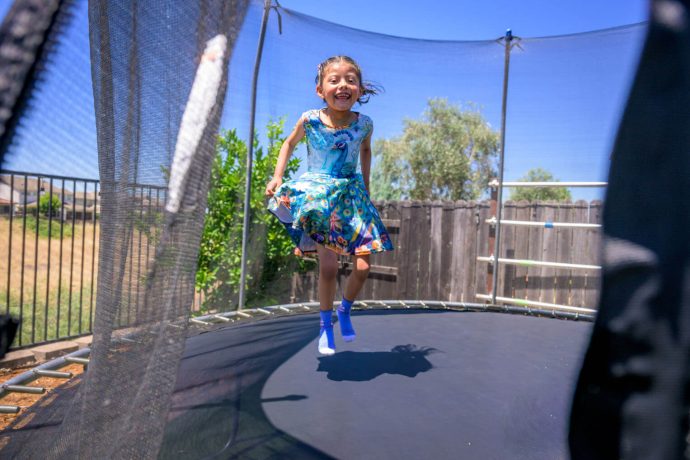 Dara jumping on a trampoline