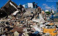Residents search through the rubble after an earthquake struck Pereira, Colombia, Monday, Aug. 10, 2026.