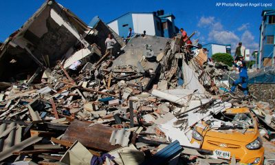 Residents search through the rubble after an earthquake struck Pereira, Colombia, Monday, Aug. 10, 2026.