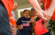 Volunteers pray with a flood survivor in Uvalde County, Texas, after helping cleaning out her home.