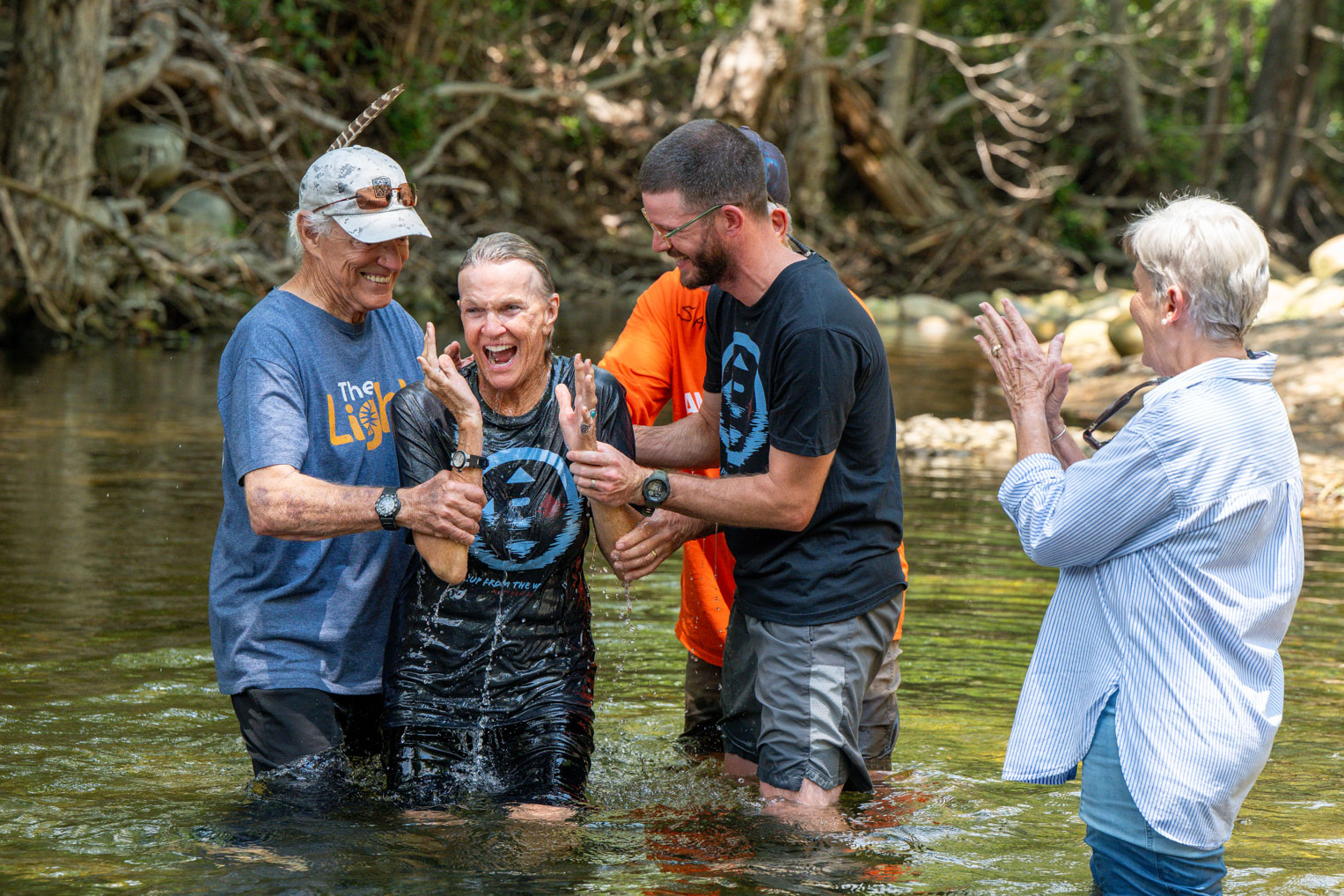Willi Baldwin was baptized in the creek that had taken the home where she and her husband, Michael, had lived for decades.