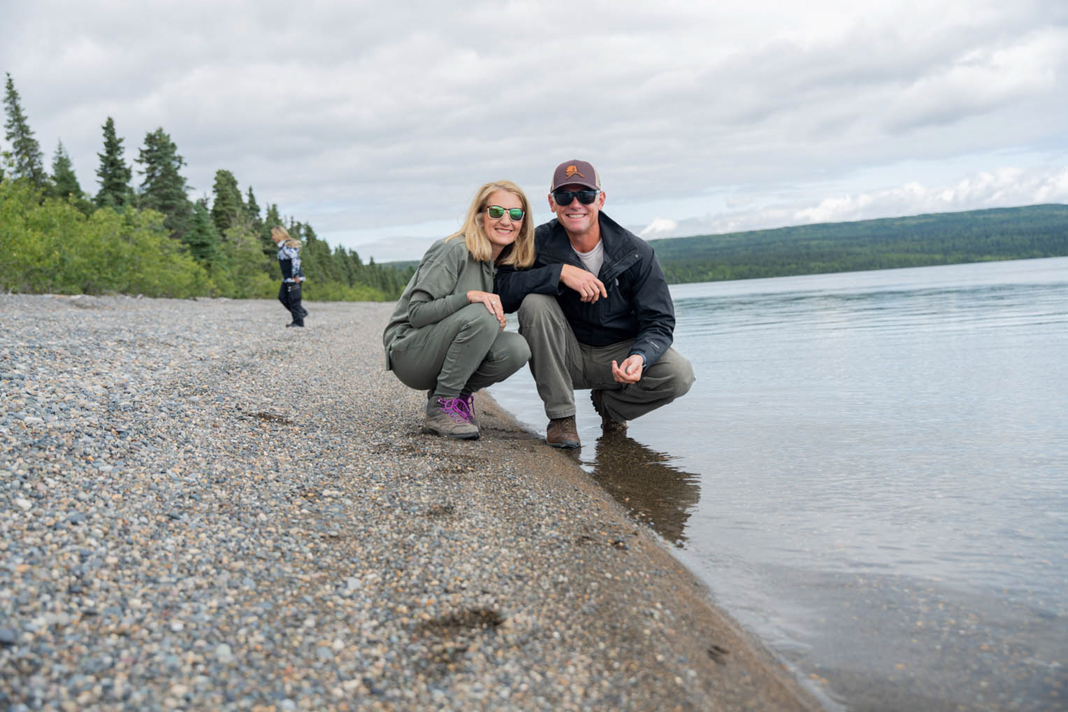 The Seviers collect special stones from a beach on Lake Illiamna.