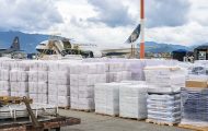 The Samaritan's Purse 767 sits on the tarmac in Kathmandu and is surrounded by the loads of relief.