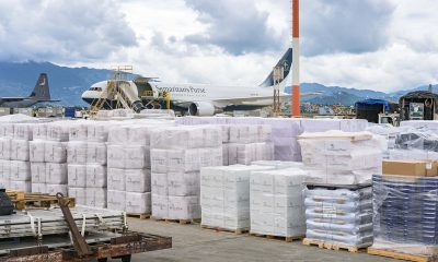 The Samaritan's Purse 767 sits on the tarmac in Kathmandu and is surrounded by the loads of relief.