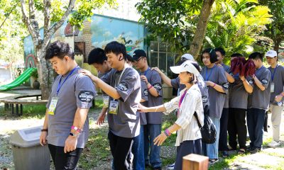 Cuong (left) participates in a group activity with other visually impaired students.