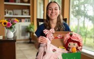 Adryana displays packed shoebox gift