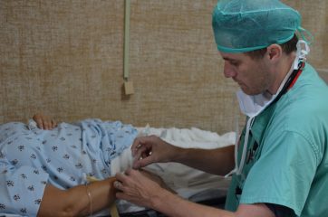 Dr. Hotz cares for a patient in Honduras. 