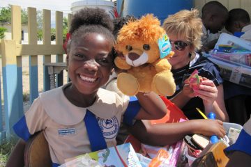 Children are thrilled to receive stuffed animals in their shoeboxes. 